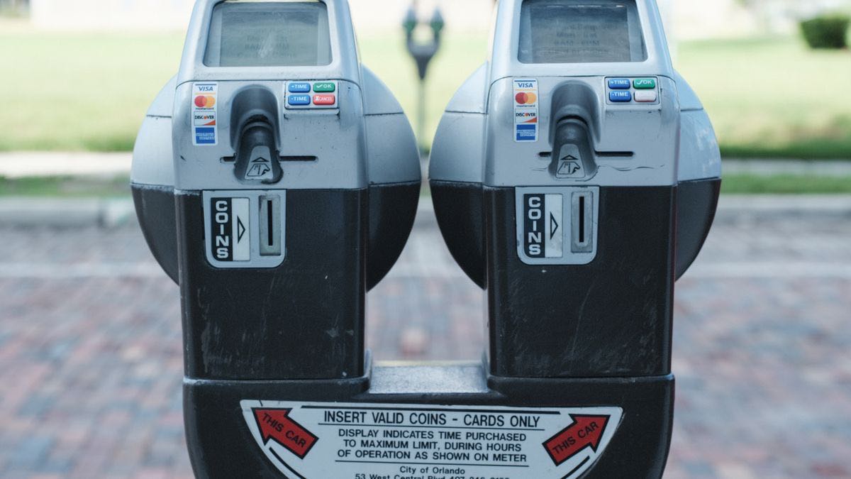 A close-up of a taxi meter counting up, illustrating the pay-per-record credit meter that replaced X's flat monthly API tiers