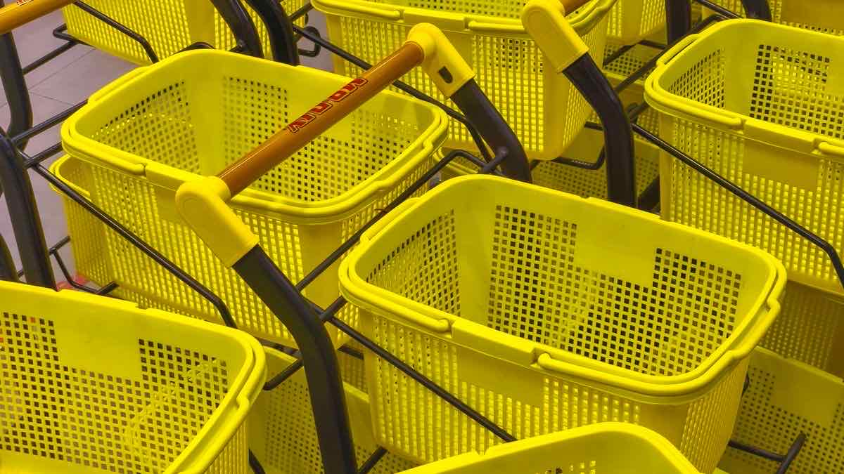 A set of shopping baskets lined up in a row, illustrating the same basket of X records priced across five different providers