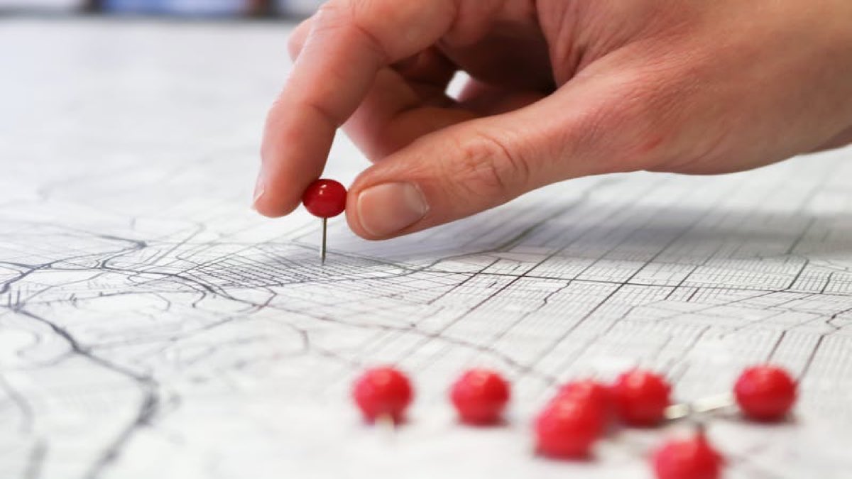 Map pin on a city map representing place identifiers