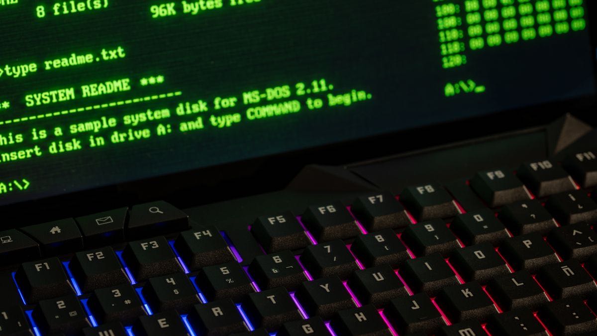 A retro green-on-black MS-DOS terminal screen above a backlit keyboard, evoking the era of plain-HTTP scrapers