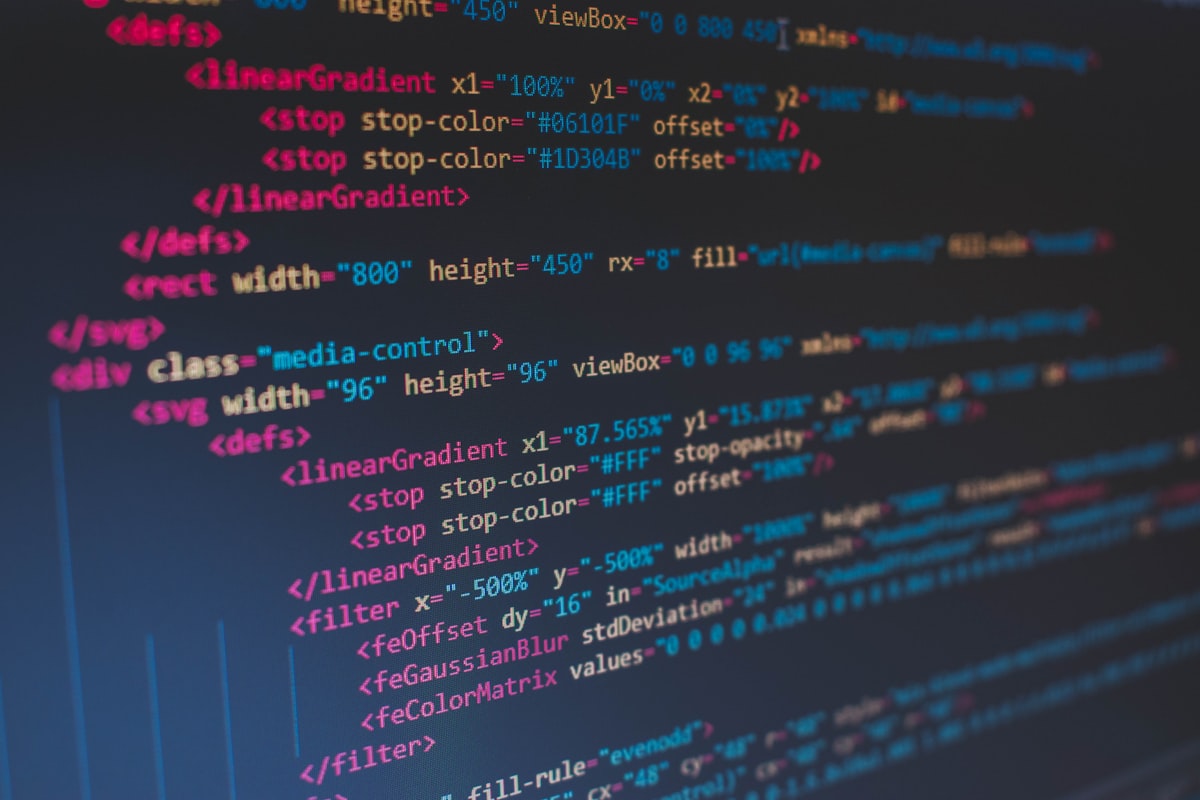 Colorful source code on a dark screen, representing the decoupled search-then-prompt code pattern