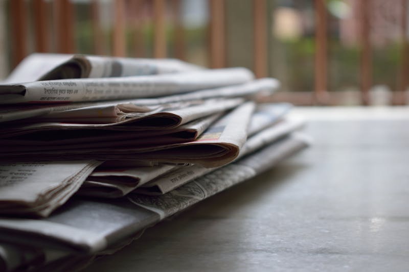 Newspaper with articles representing news API data sources