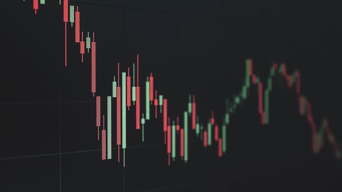 A candlestick stock chart with green and red lines, illustrating price movement tracked by an alert system