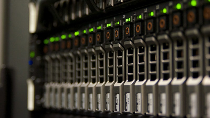 Close-up of a server rack with rows of green status lights, representing the cron job infrastructure that runs scheduled rank checks