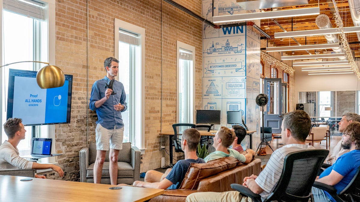 A group of people in a discussion, representing community and forum conversations that now feed AI answers