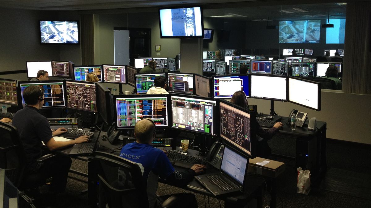 A network operations room full of monitors, representing rotating vs sticky proxies for scraping