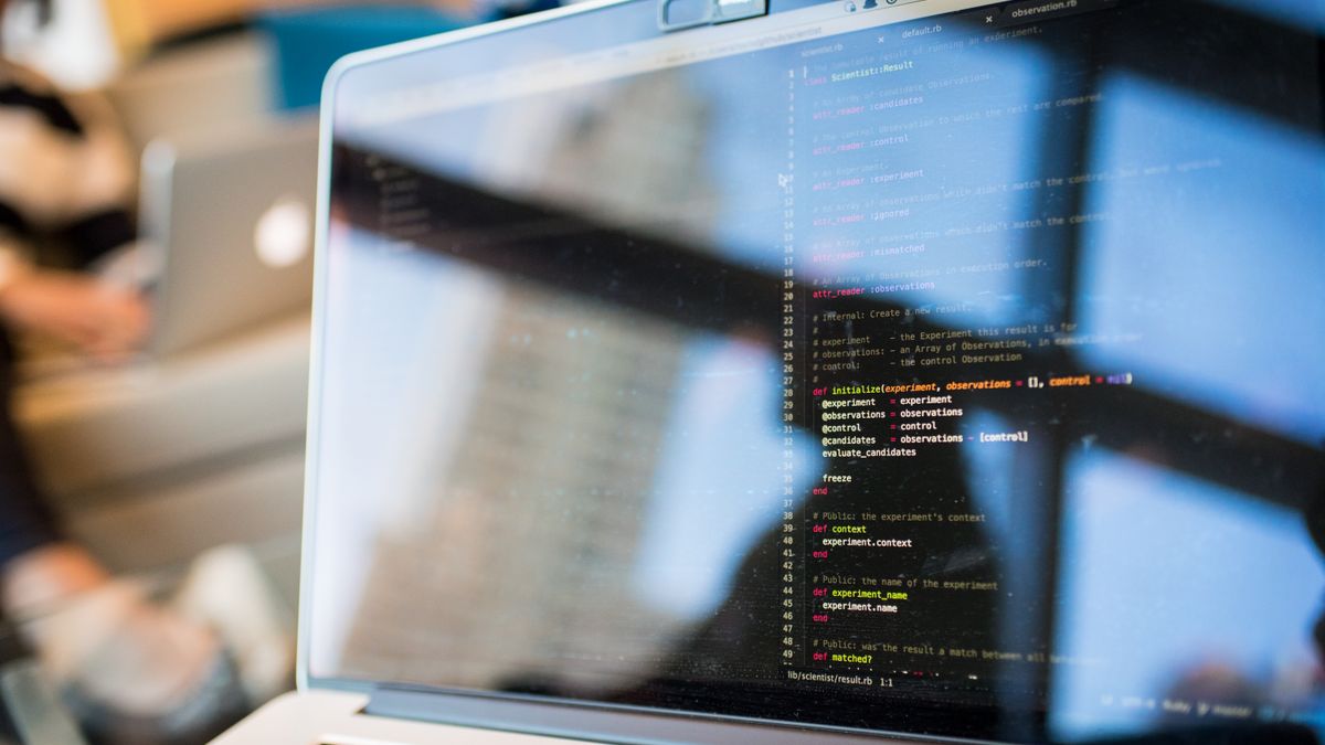 A laptop with code, representing scraping Bing for free