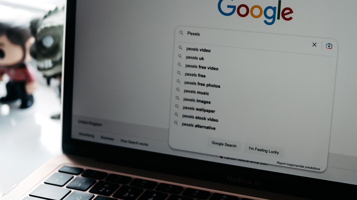 A laptop showing the Google search box, representing scraping Google for free