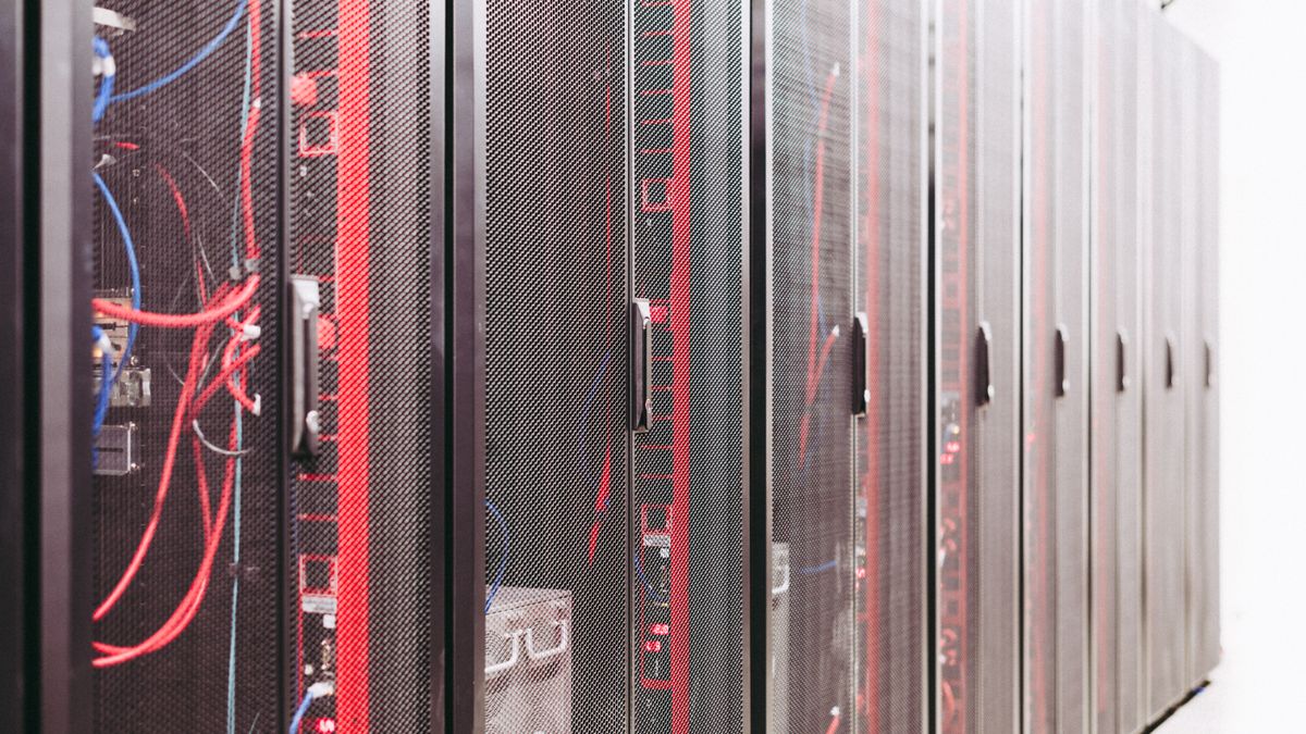 Rows of servers in a data center, representing the residential proxy pool behind a Google scraper