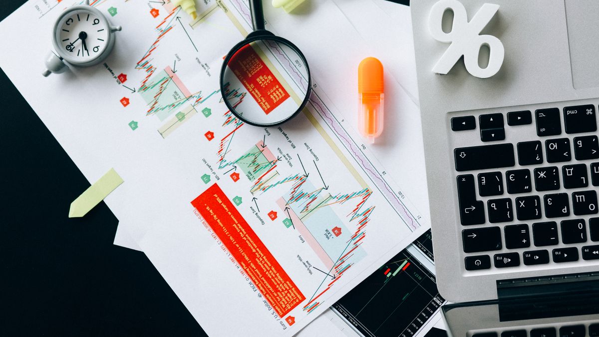 A magnifying glass over data, representing scraping Yahoo for free