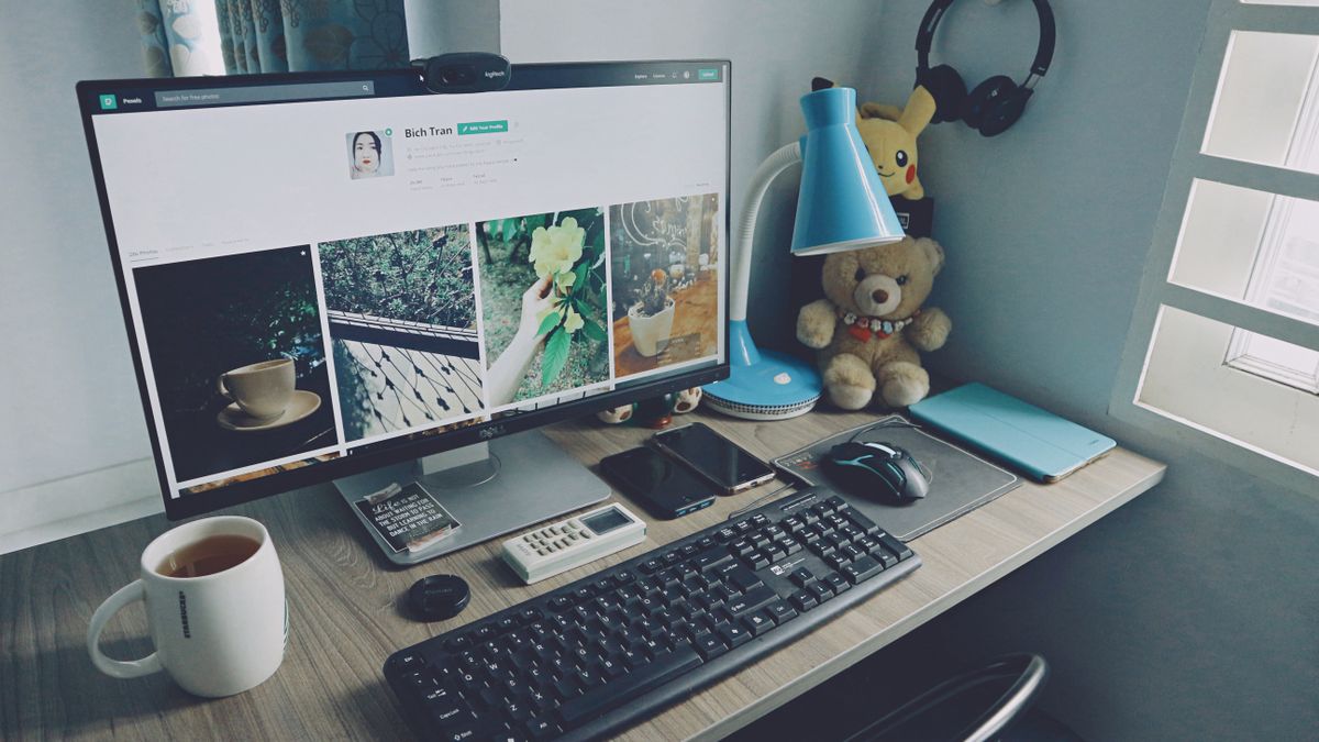 A workspace with multiple monitors, representing a scraping job queue and observability