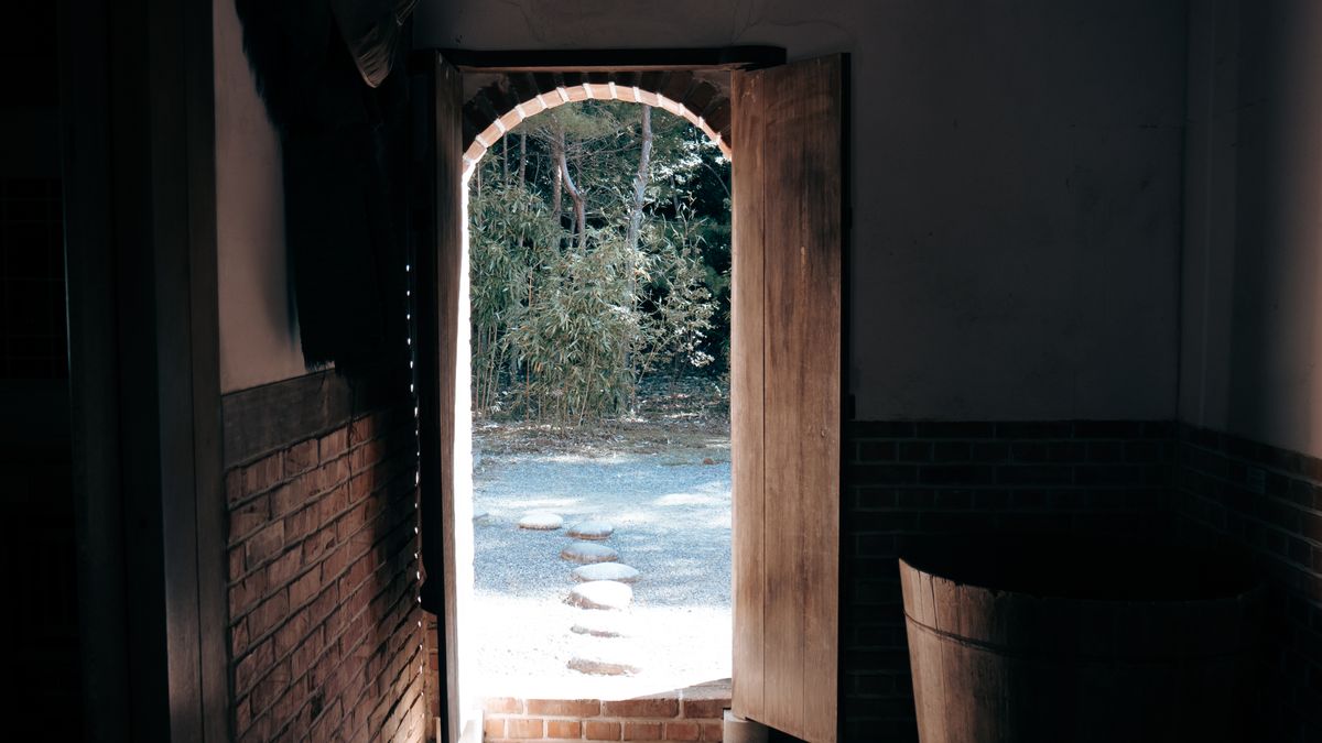 Light streaming through an open door, representing a SERP API with no minimum deposit and a free tier