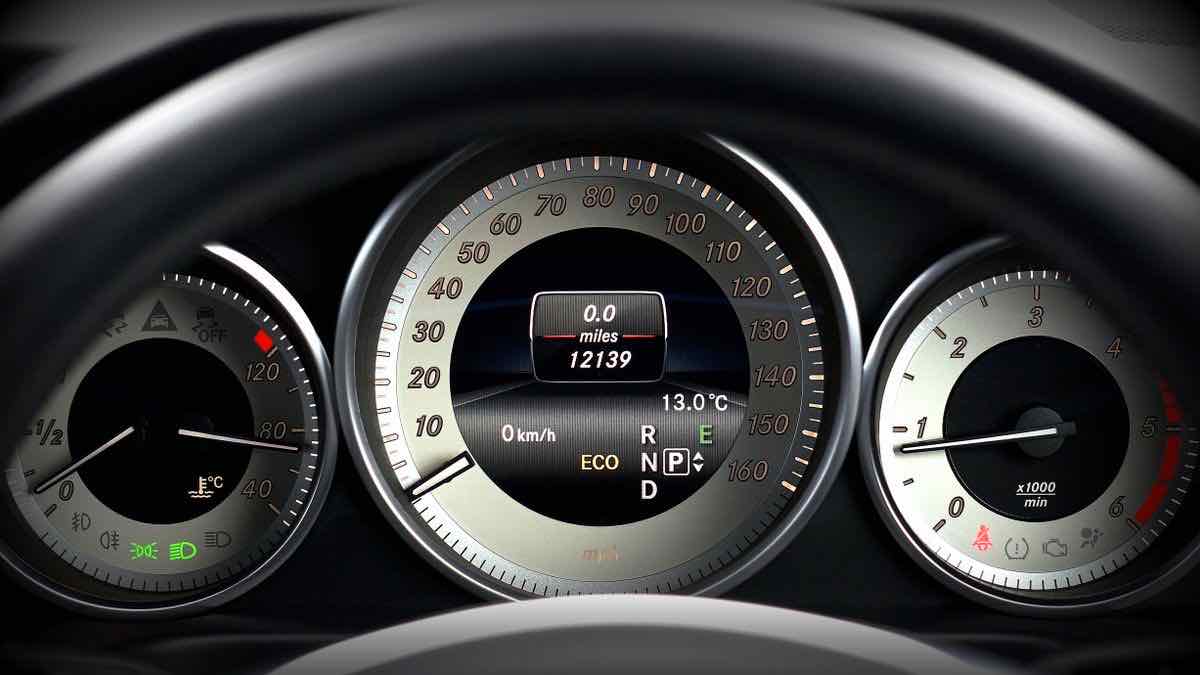 A car dashboard speedometer cluster reading zero, representing measuring sustained request throughput
