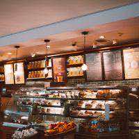 Cafe counter with pastry cases and shelves of coffee
