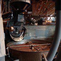 Freshly roasted beans turning in a roaster's cooling tray